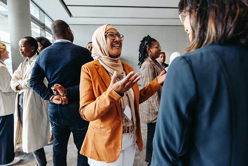 Woman in hijab at a networking event