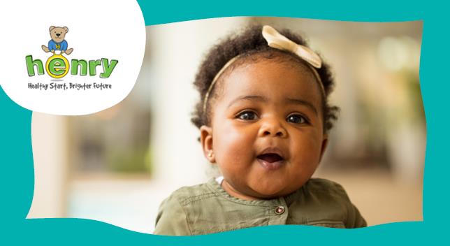 An image of a toddler smiling with the HENRY logo in the top-left corner