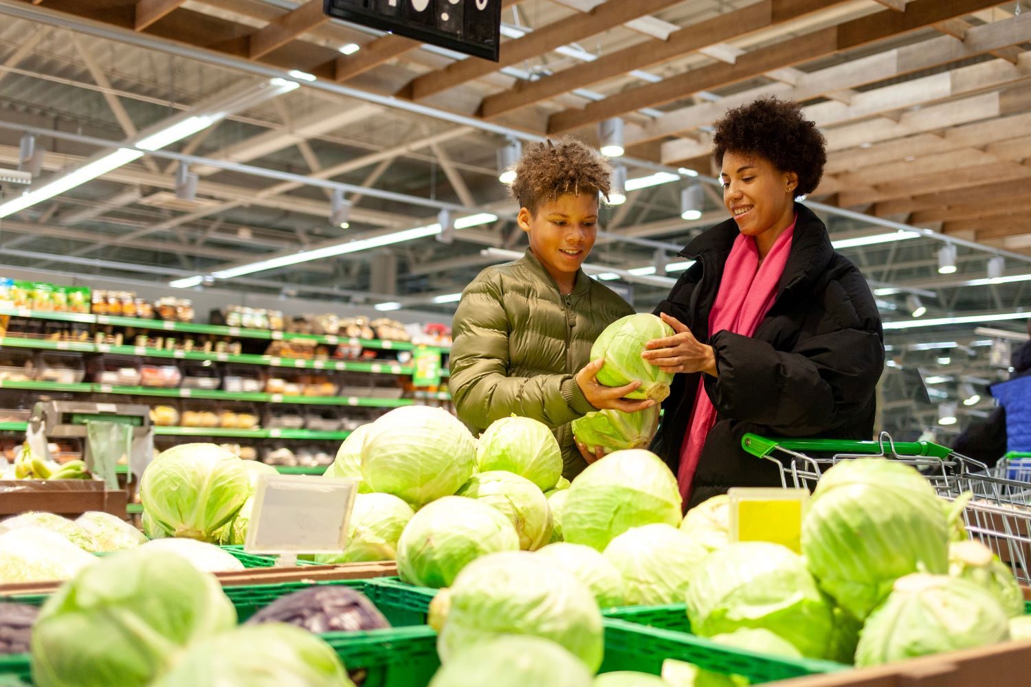 Woman and son shopping for vegetables